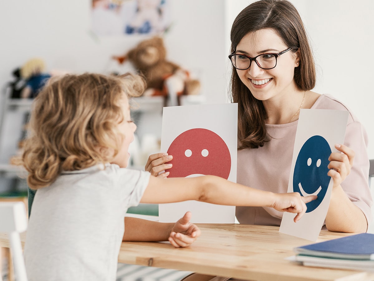 child identifying feelings via emotion cards