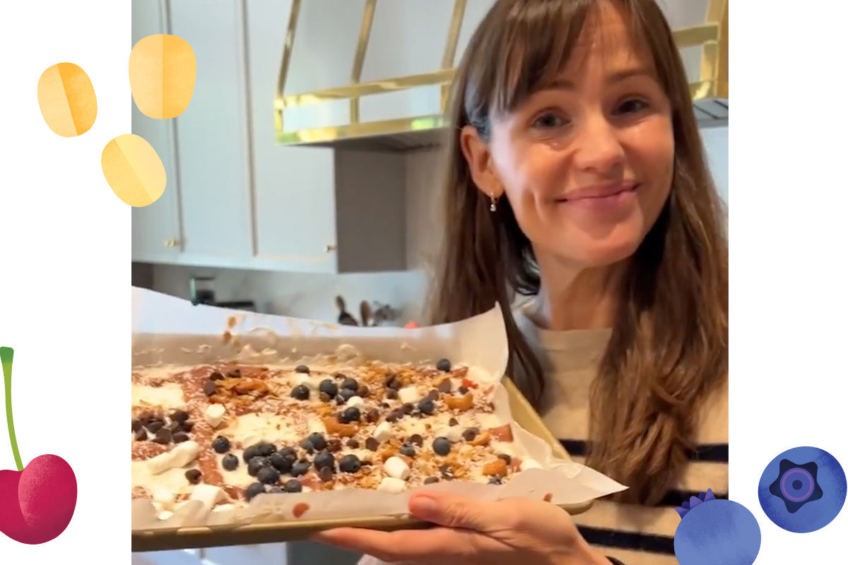 Jennifer Garner holding a tray of frozen yogurt bark