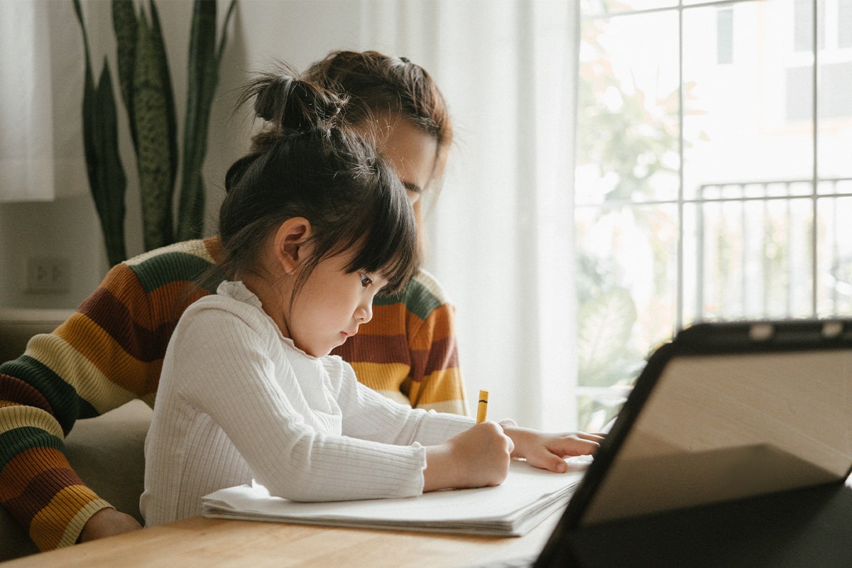 mom helping child with homework