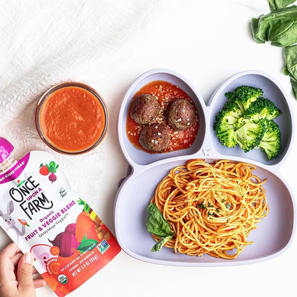 Meatballs, broccoli, and a plate of pasta with veggie pasta sauce made with Once Upon a Farm fruit & veggie pouch.