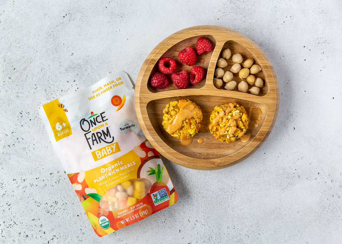mango carrot veggie patties, plated with raspberries and chickpeas