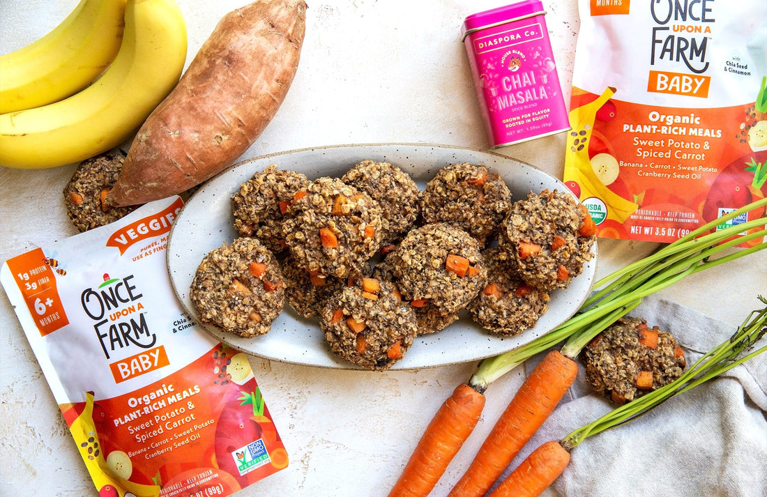 Chai-spiced breakfast cookies on a plate, surrounded by the ingredients used to make them
