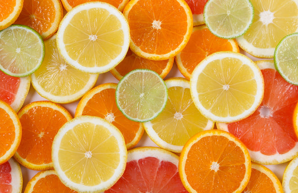 various citrus fruit slices arranged on top of each other