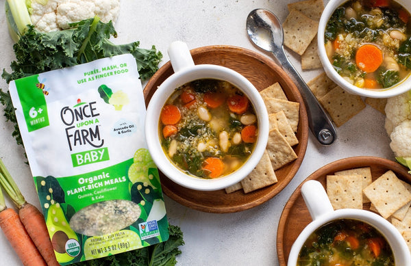 Once Upon a Farm Plant-Rich Meal next to a bowl of vegetable soup and crackers