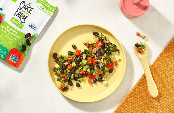 Once Upon a Farm meal on a plate, with the packaging next to it