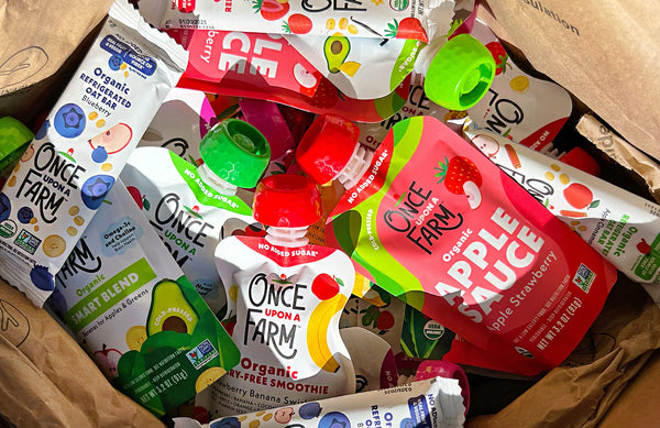 Box of refrigerated Once Upon a Farm pouches and bars