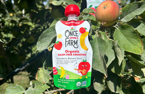 Once Upon a Farm pouch in an apple tree