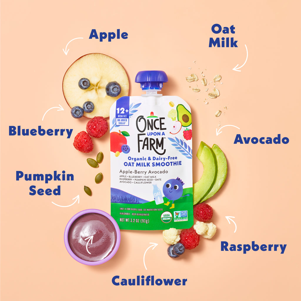 Once Upon a Farm organic oat milk smoothie pouch with ingredients displayed around it on a peach background. Apple, Oat Milk, Avocado, Raspberry, Cauliflower, Pumpkin Seeds, and Blueberries. 
#svg:apple-berry-avocado-oat-milk-smoothie-ingredients