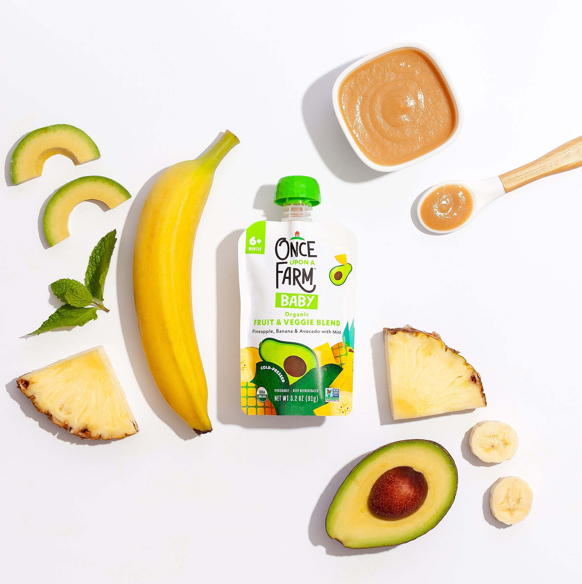 Pineapple_Banana_Avocado_Mint packaging surrounded by real ingredients in the blend.