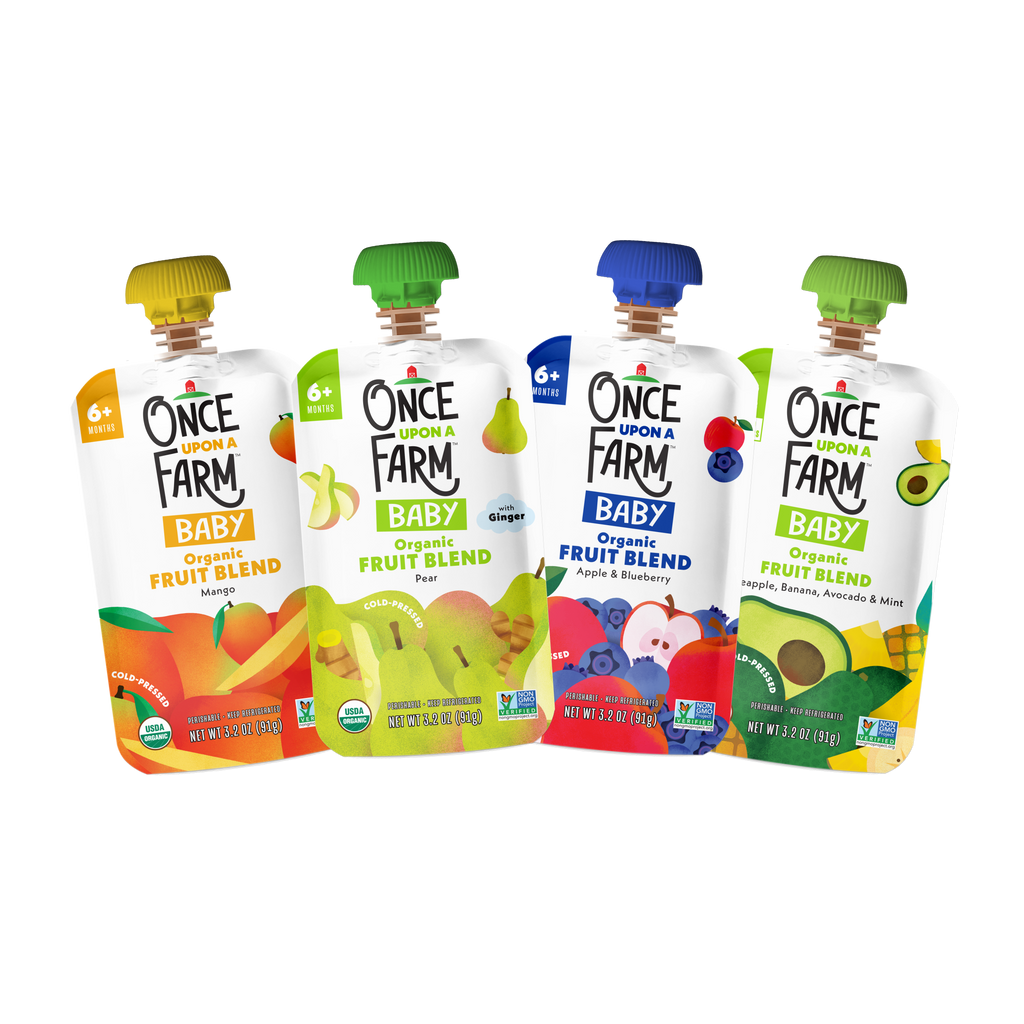 Four Once a Farm Baby Organic Fruit Blend pouches in different flavors (Peach, Pear, Blueberry, and Avocado) arranged in a row on a solid white background.