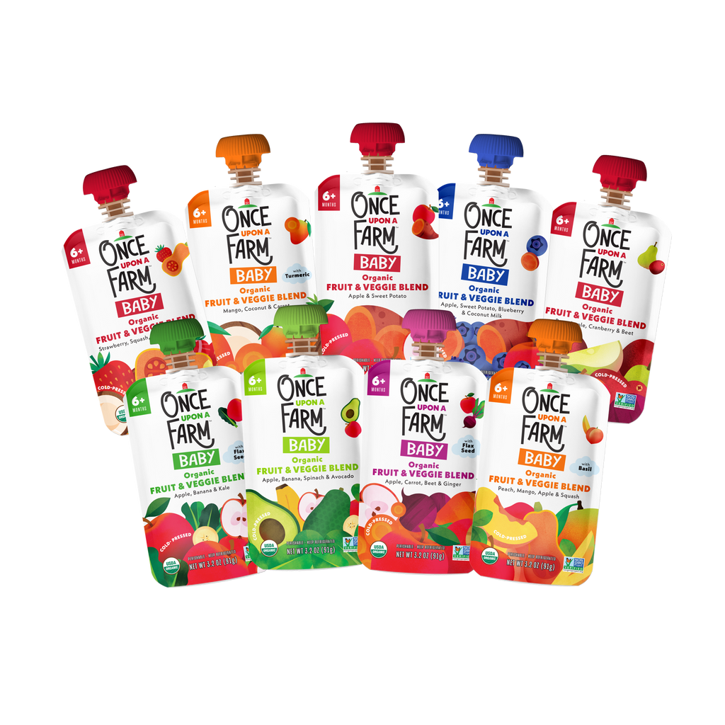 A group of Once Farm Baby fruit and veggie blend pouches arranged together on a plain white background. The packaging shows different fruit and vegetable flavor options with colorful illustrations and the Once Farm Baby branding.