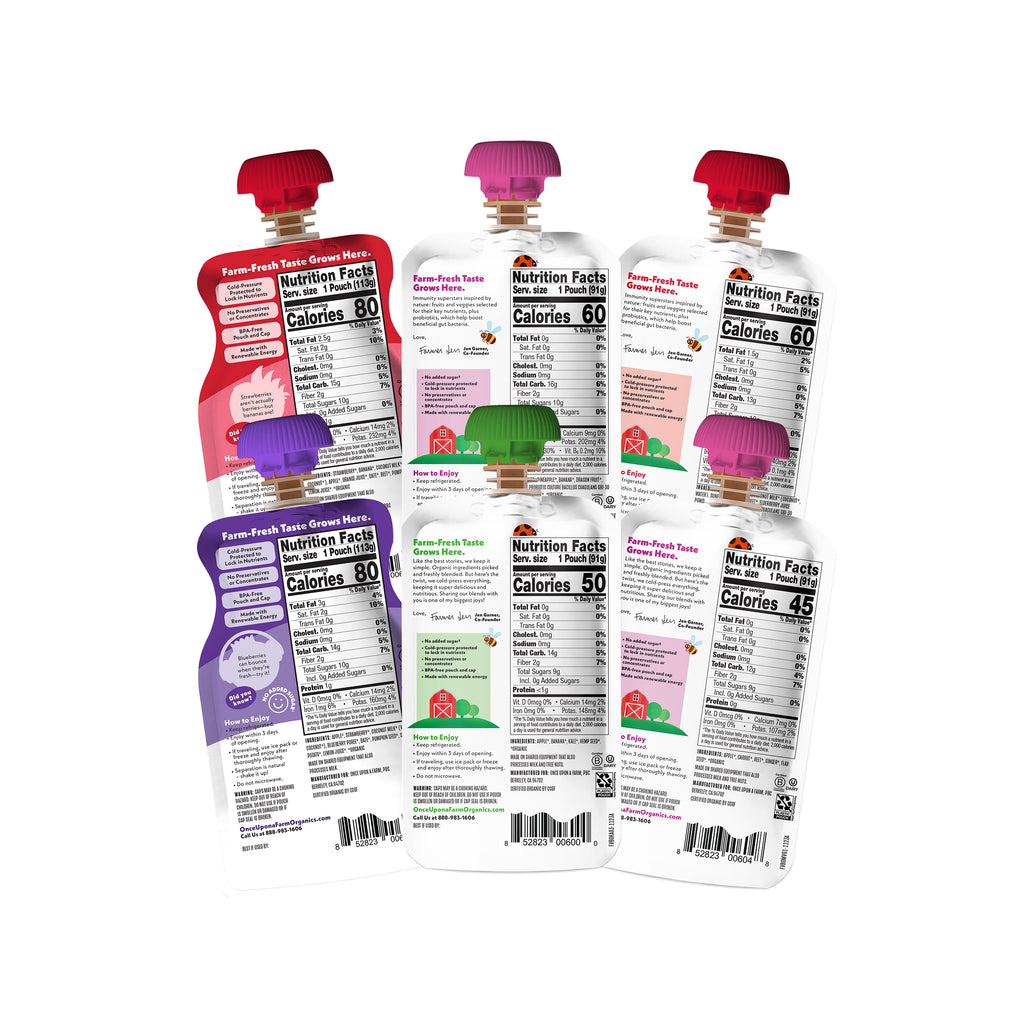 Six Farm Fresh Fruit & Veggie Back-to-School Essentials pouches arranged in two rows on a white background, showing the back labels with nutrition facts and different fruit flavors including strawberry, peach, grape, and melon.
