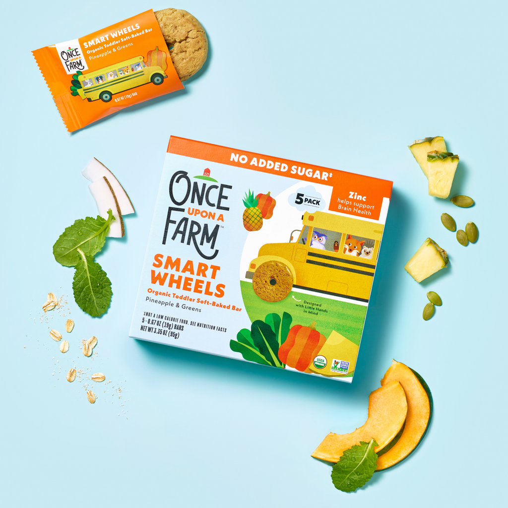 Box of 'Once Upon A Farm' Smart Wheels with snacks on a light blue background